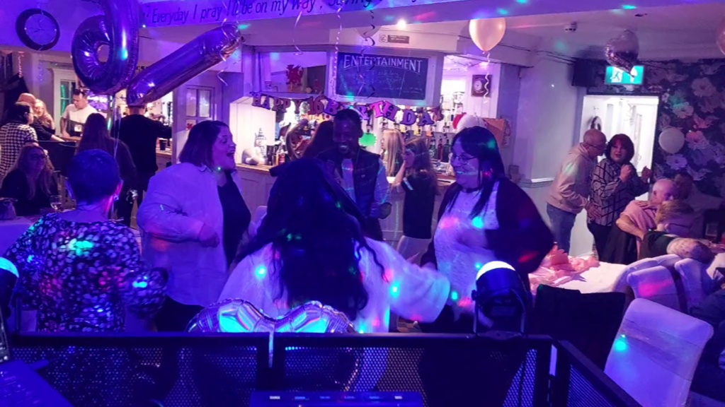 People dancing at a 16th birthday party in Holyhead, Anglesey